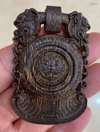 A CHENXIANG WOOD TABLET CARVED WITH BEAST PATTERN