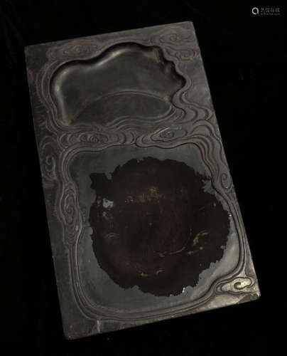 AN INK SLAB CARVED WITH PATTERN