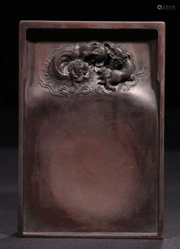 AN INK SLAB CARVED WITH BEAST PATTERN