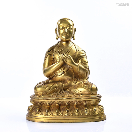 A GILT-BRONZE FIGURE OF GURU.QING PERIOD