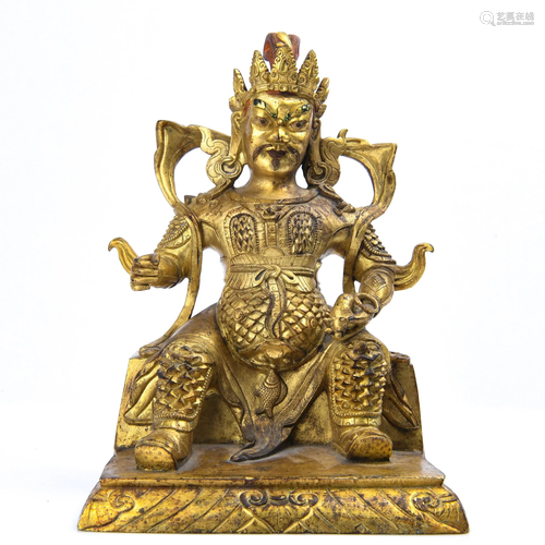 A GILT-BRONZE FIGURE OF VAISHRAVANA.QING PERI…