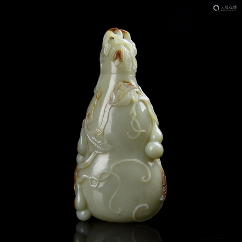 A CARVED WHITE JADE DOUBLE-GOURD VASE.QING …