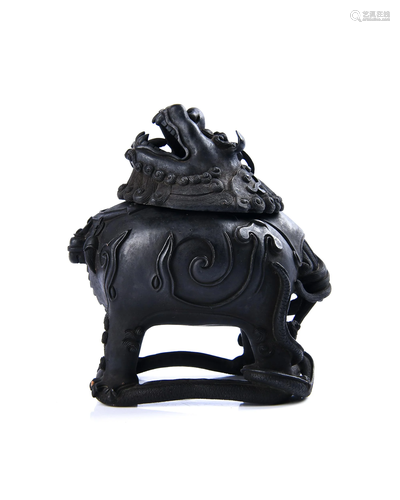 A CARVED BRONZE 'BEAST' BURNER .QING PERIOD