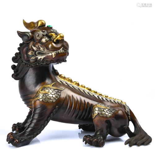 A GILT-BRONZE BEAST .QING PERIOD