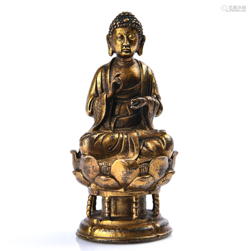 A GILT-BRONZE FIGURE OF SAKYAMUNI.MING PERIOD