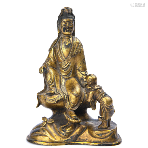 A GILT-BRONZE FIGURE OF GUANYIN AND BOY.QIN…