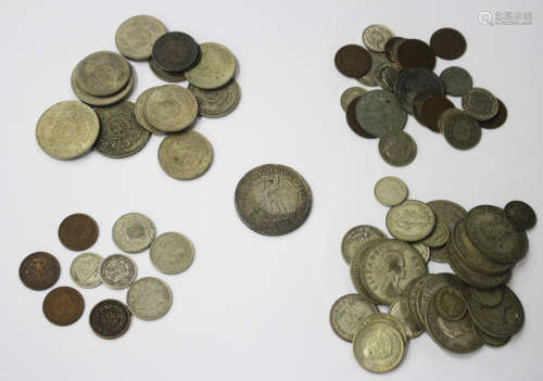 A large collection of various 19th and 20th century world coinage and banknotes, some contained