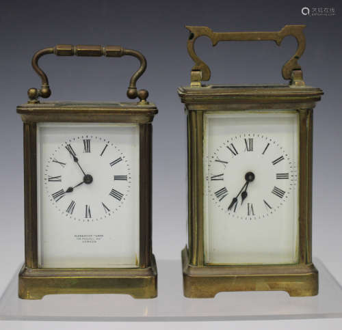 Two early 20th century French brass carriage timepieces, each glazed case with swing handle, heights