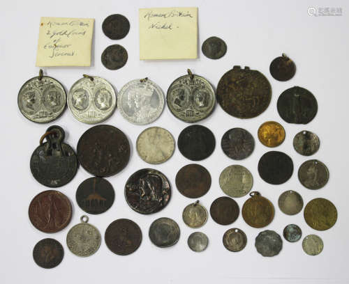 A collection of various 18th and 19th century tokens and medallions, including a Waterberry Watch