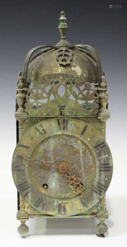 A late 19th/early 20th century brass lantern clock with eight day movement striking on a bell, the