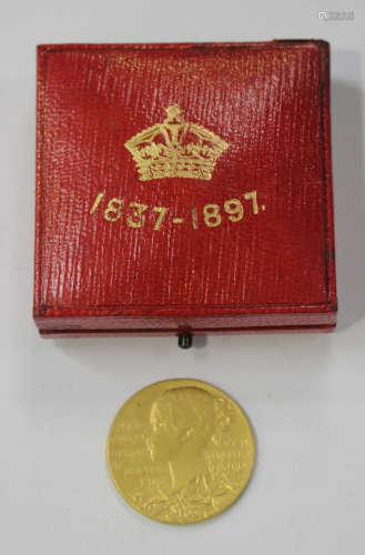 A Queen Victoria Diamond Jubilee 1837-1897 gold medallion, designed by T. Brock, within original