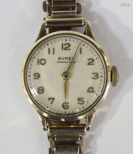 A Buren Grand Prix 9ct gold circular cased lady's wristwatch, the signed dial with gilt Arabic
