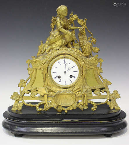 A mid to late 19th century French gilt metal mantel clock with eight day movement striking on a bell