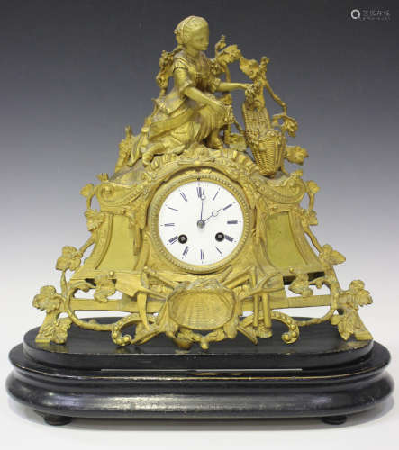 A mid to late 19th century French gilt metal mantel clock with eight day movement striking on a bell