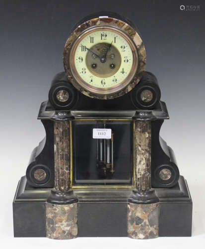 A late 19th century slate and marble cased mantel clock with eight day movement striking on a