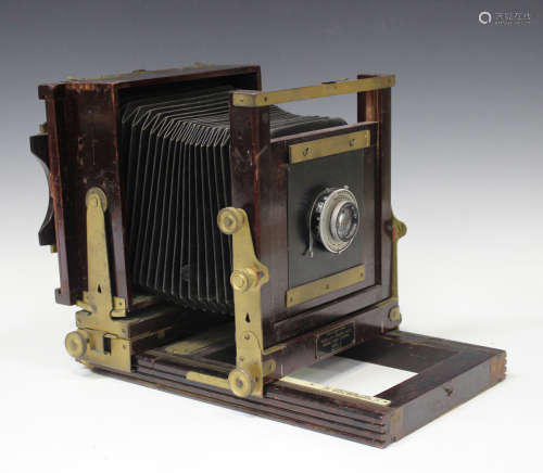 A Kodak 'Model B' folding view camera with black bellows and brass mounts, fitted with a Ross of