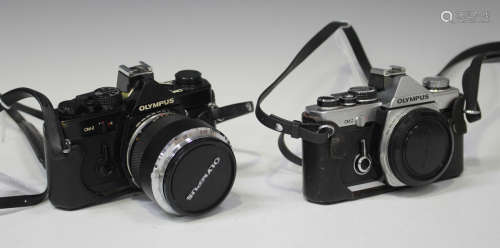 A collection of Olympus cameras and accessories, comprising an OM-2 camera with Auto-S 1:1.2 F=