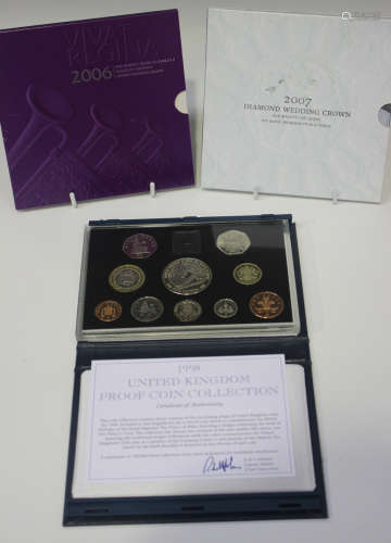 A collection of Royal Mint issue year-type specimen coin sets, together with a Royal Mint issue