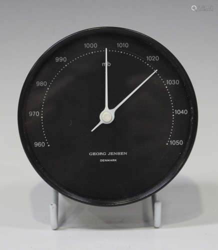 A Georg Jensen circular barometer, circa 1962, the signed black dial with white detail within a