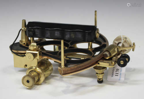 A mid-20th century Kelvin & Hughes brass sextant, signed, the fitted hardwood case with hinged lid.