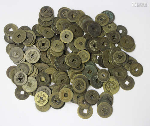 A collection of Chinese bronze cash, pierced with square holes to the centres.Buyer’s Premium 29.