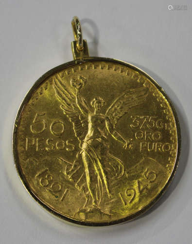 A Mexico gold fifty pesos 1821 1945 in a gold pendant mount, detailed '14K 585'.Buyer’s Premium 29.