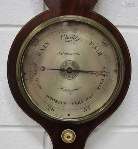 A George III mahogany cased wheel barometer, the silvered dial inscribed 'A Guarnerio', with later
