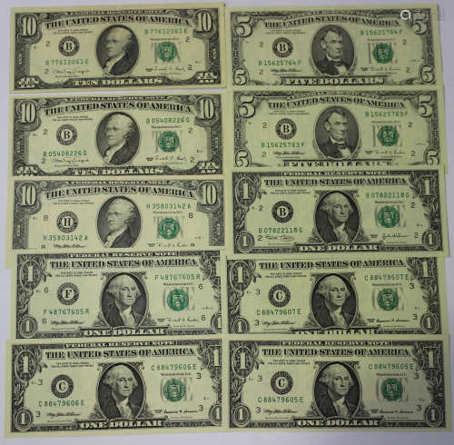 A group of USA banknotes, comprising three ten dollars, two five dollars and five one dollar bills.
