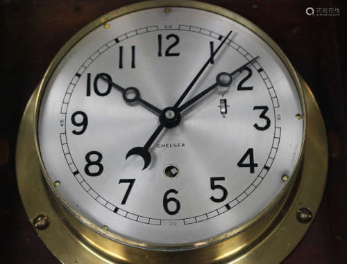 A mid-20th century brass circular cased ship's timepiece by Chelsea Clock Co, the eight day movement
