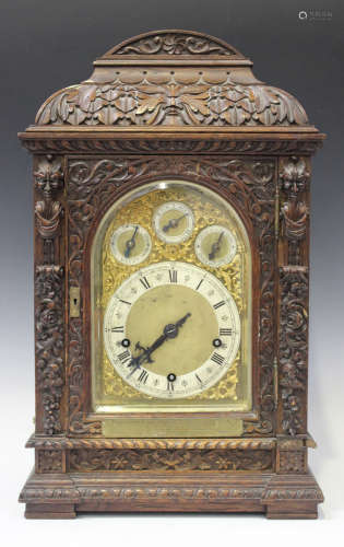 A late Victorian oak cased bracket clock with German eight day three train movement chiming quarters