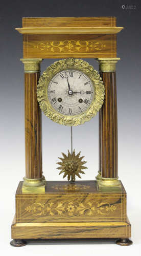 A late 19th century French rosewood portico mantel clock with eight day movement striking on a