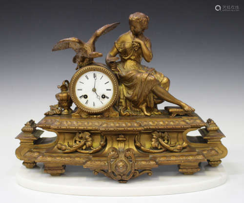 A late 19th century French gilt painted spelter mantel clock with eight day movement striking on a