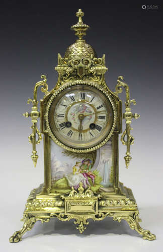 A late 19th century French brass and porcelain mantel clock with eight day movement striking on a