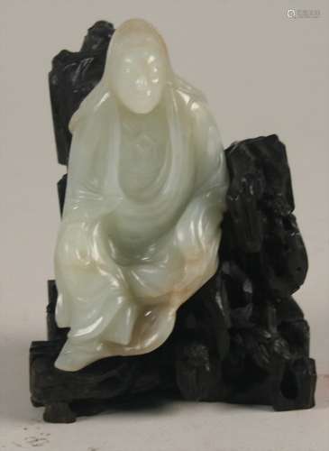 Chinese Greyish-White Carved Jade Seated Figure of Guanyin, 18th/19th century