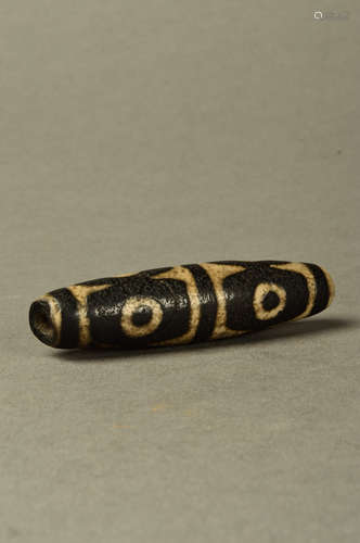 A Chinese Carved Hetian Jade Six-Eyed Dzi bead