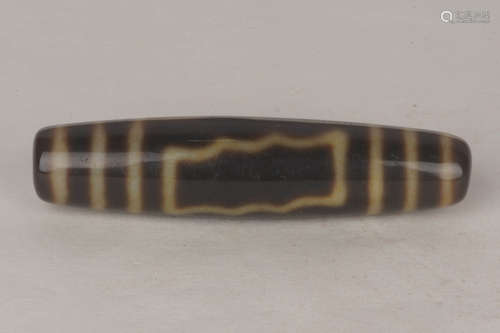 A Chinese Carved Hetian Jade Three-Eyed Dzi bead