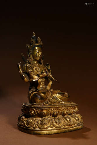 A Chinese Gilded Copper Statue of 4 Arms Guanyin