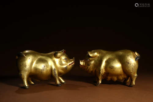A Pair of Chinese Gilded Copper Pig Ornaments