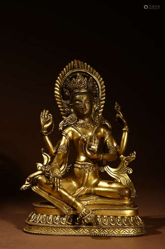 A Chinese Gilded Copper Guanyin Statue