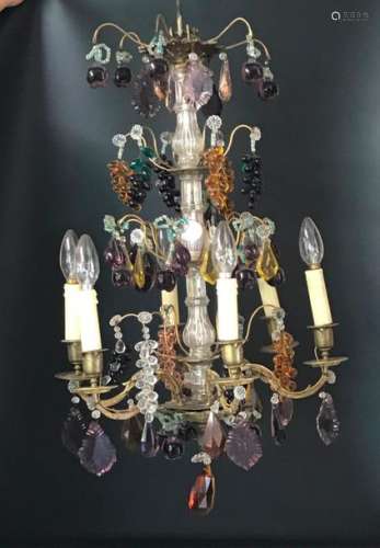 Golden brass chandelier decorated with pendants an…