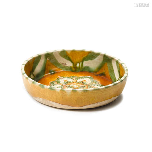 A sancai shallow bowl with floral center  Liao dynasty