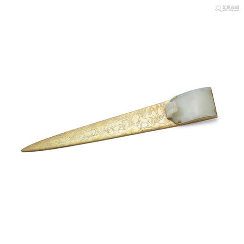 A carved jade belt hook mounted as a letter opener