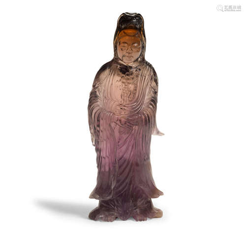 An amethyst sculpture of a standing guanyin   Qianlong mark, Late Qing/Republic Period