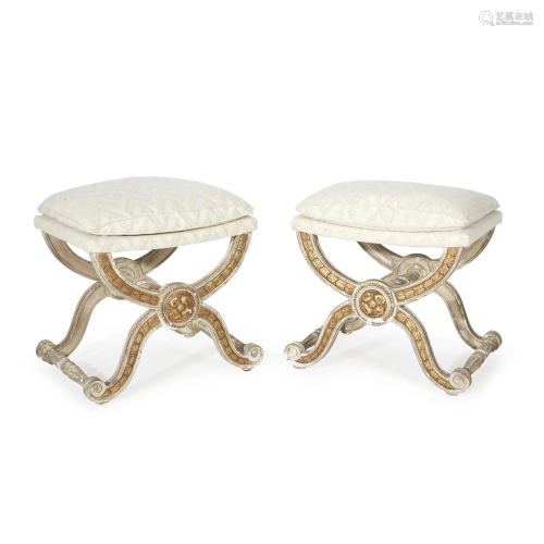 A pair of Louis XVI style cream-painted and parcel-gilt