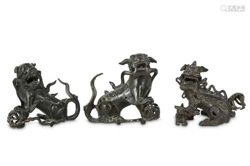 Three Chinese bronze Buddhist lion dogs.