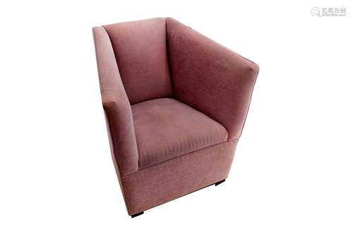 A contemporary armchair, upholstered in lavender fabric