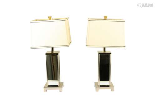 A pair of contemporary mirrored table lamps with shades