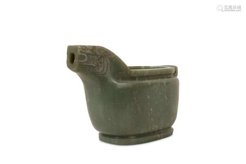 A CHINESE PALE CELADON JADE ARCHAISTIC POURING VESSEL.