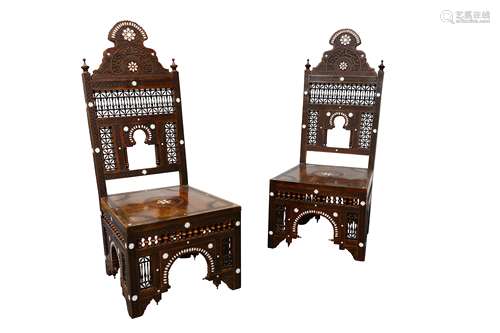 A pair of mother-of-pearl-inlaid and carved wooden chairs, possibly Syria or North Africa, 20th