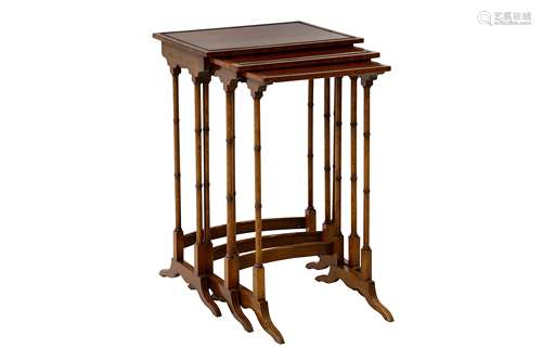 A nest of three mahogany occasional tables